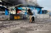 Рятувальники приборкують пожежу на терміналі «Нової пошти» у Дніпрі після ворожої атаки