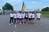 Прапор України з Бахмута — на саміт НАТО: команда українських бігунів передала стяг на кордоні з Польщею друзям з Литви