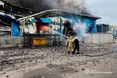 Рятувальники приборкують пожежу на терміналі «Нової пошти» у Дніпрі після ворожої атаки